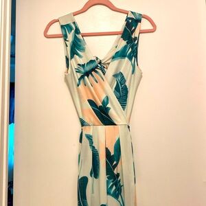 Tropical wrap style maxi dress with double front slits & open tie back.